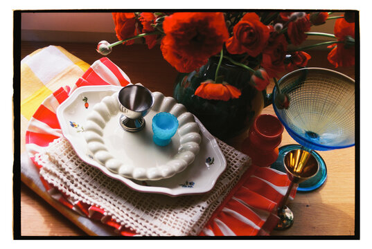 Colorful table setting with flowers and elegant dinnerware