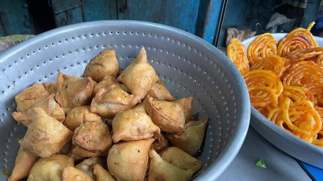 Samosa and jalebi sold in a road side stall in India