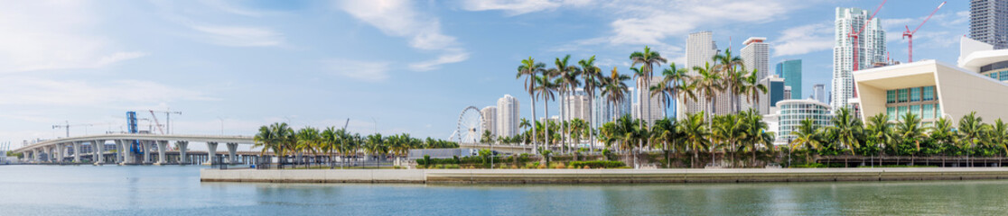 Modern skyline of Miami with towering skyscrapers, tropical vibe, and waterfront views