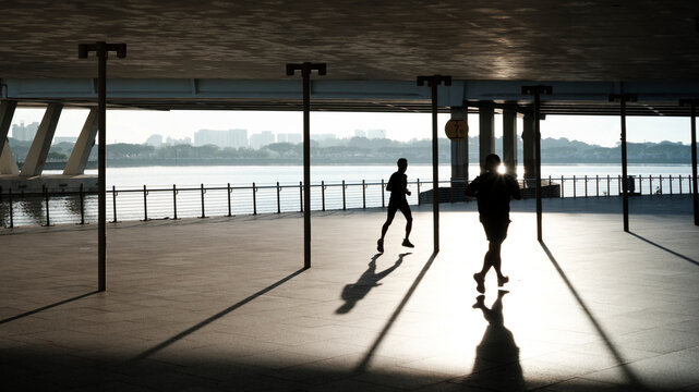 Silhouettes of people exercising
