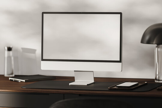 A blank computer monitor in a modern workplace, 3d