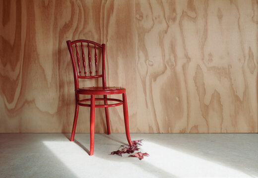 Vintage red kitchen chair and fall leaves