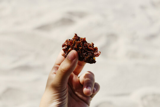 A piece of cocada, a traditional brazilian desert made of coconut 