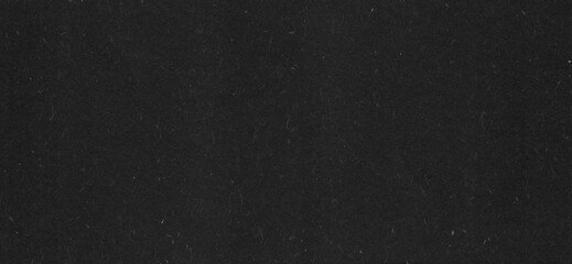 Luxury black paper texture background. Abstract dark gray craft cardboard blank. top view.