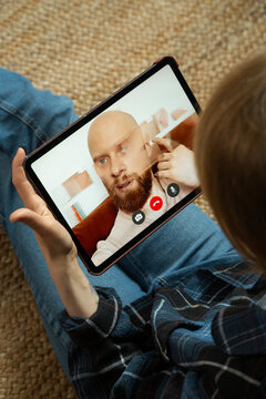 Woman video calling partner experiencing bad internet connection