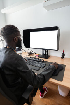 Video editor working from home using computer with blank screen