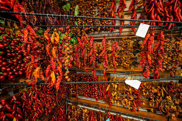 Great view of thousands of threaded chili peppers hanging from a wall at the Mercado dos Lavradores...