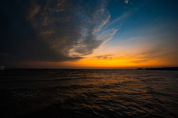 Picture of the atmosphere of the sea in the evening, the light and color of the sky are beautiful.