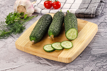 Raw green cucumbers with slices
