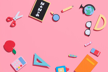 school supplies at colorful paper background