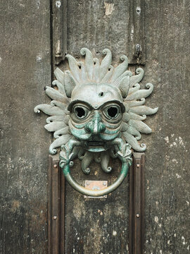 Medieval mask door knocker