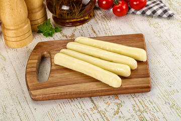 White mozzarella sticks over board