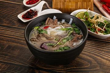 Vietnamese Pho Bo soup with beef and noodles