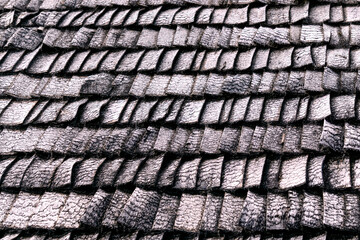 Old traditional wooden shingle roofing in the countryside.