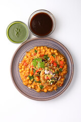 Ragda patice chaat or Indian street food made with potato tikki and white dried peas curry