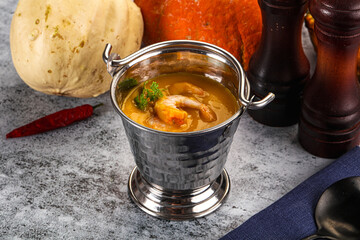Pumpkin cream soup with prawns