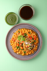 Ragda patice chaat or Indian street food made with potato tikki and white dried peas curry