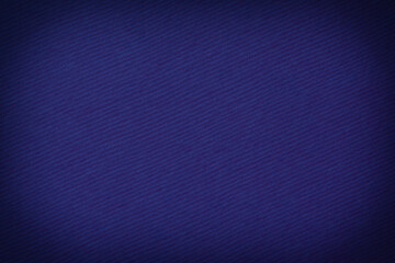 blank dark blue background: close up of striped cardboard texture with shadowed edges