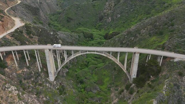 Bixby Creek Bridge Big Sur California coastal canyon and rv driving 4k aerial drone video