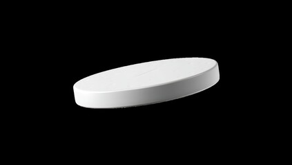 White, round, flat disc, slightly angled, against black background