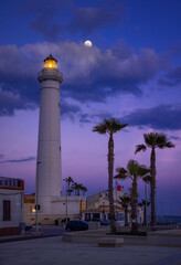 Captivating Twilight at Punta Secca Lighthouse Under a Glowing Moon, Sicily, Italy