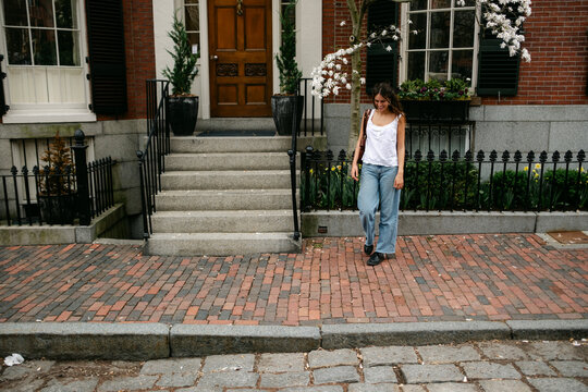Young woman in street in Beacon Hill in Boston, New England 