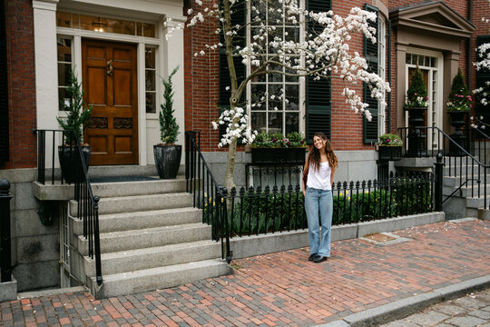 Young woman in street in Beacon Hill in Boston, New England 