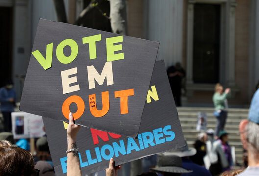 Signs from HANDS OFF protest