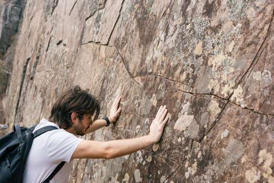 Exploring ancient rock art during a scenic hike in nature