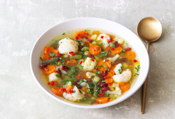 Vegetable soup with cauliflower, beans, carrots and zucchini. Healthy eating. Vegetarian food.