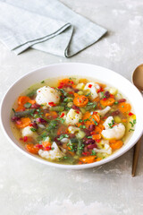 Vegetable soup with cauliflower, beans, carrots and zucchini. Healthy eating. Vegetarian food.