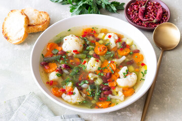 Vegetable soup with cauliflower, beans, carrots and zucchini. Healthy eating. Vegetarian food.