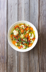 Vegetable soup with cauliflower, beans, carrots and zucchini. Healthy eating. Vegetarian food.