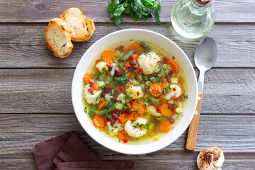 Vegetable soup with cauliflower, beans, carrots and zucchini. Healthy eating. Vegetarian food.