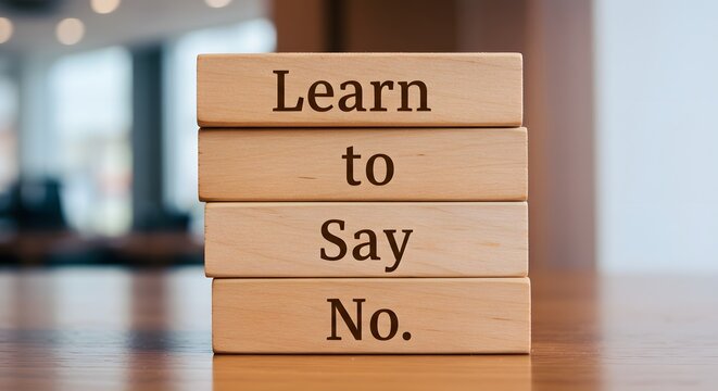 Message 'Learn to Say No' displayed on wooden cubes, promoting assertiveness and self-care

