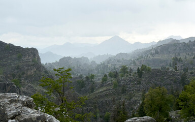 wonderful mystical landscape texture of rainy, foggy, misty and unusual mountains