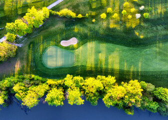 Aerial view drone shot of beautiful green golf field. Banner panorama background