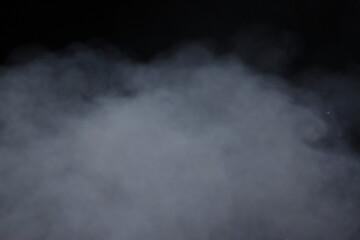 Dense White Smoke or Fog Billowing Against a Pure Black Background, Creating a Mysterious and Atmospheric Effect, Abstract Cloud of Vapor or Mist with Subtle Light