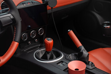 Detailed Close-Up of a Sports Car Gear Shift and Interior Features. 
