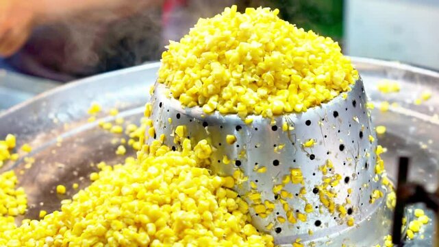 Jagung keju tarik (pulled cheese corn). Steam corn mixed with cheese. Indonesian modern street food.