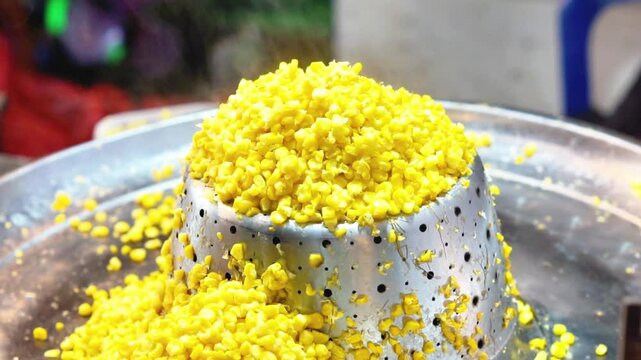 Jagung keju tarik (pulled cheese corn). Steam corn mixed with cheese. Indonesian modern street food.