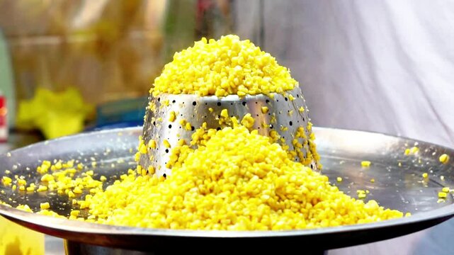 Jagung keju tarik (pulled cheese corn). Steam corn mixed with cheese. Indonesian modern street food.