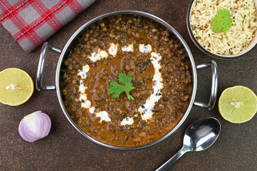 Serving Dal Makhani Punjabi dish in a bowl.