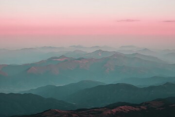 Obraz premium Dreamy pink sky over distant mountains