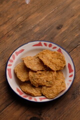 Keripik tempe. Tempeh chips are a crispy snack made from thinly sliced tempeh that is fried until dry. Indonesian food.