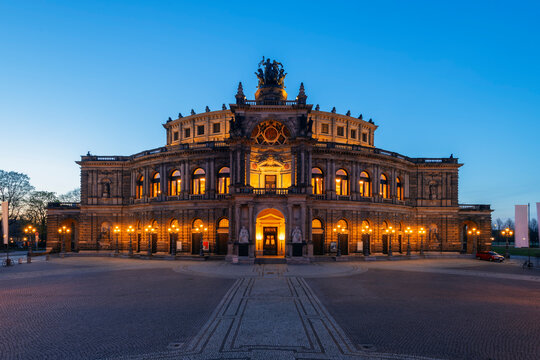 Illuminated Semperoper at dusk in Dresden, Germany