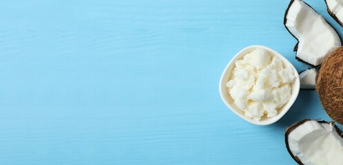 Bowl of coconut oil on table, top view