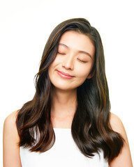 Asian girl with long flowing hair and eyes closed