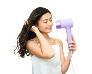 Asian girl using hair dryer