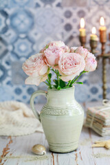 Bouquet of pink roses in ceramic vase. Postcard motif.